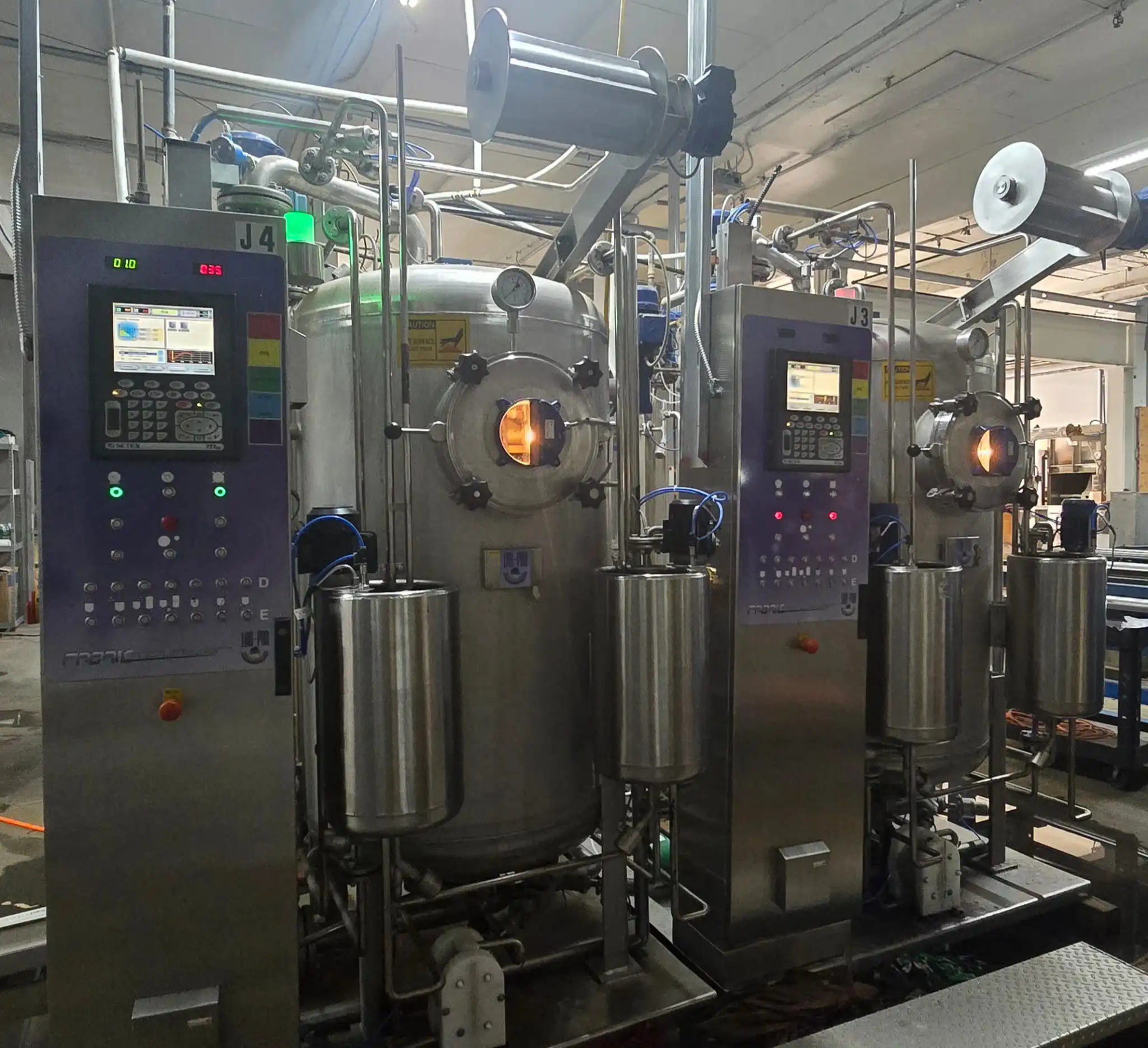 Five high-temperature high-pressure jet dyeing machines at Metro Dyeing, engineered for precision polyester fabric dyeing up to 100 pounds per batch.